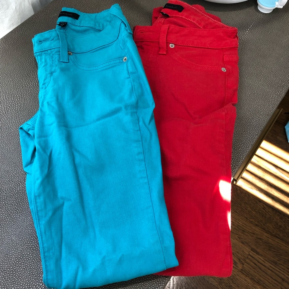 Two pairs of Bebe skinny jeans - red and turquoise